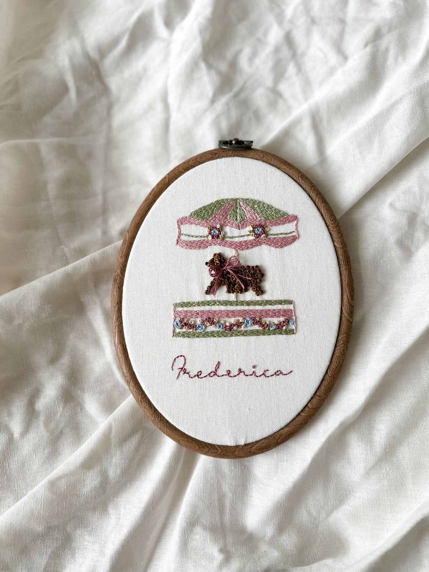 “Happy Hearts Carosel” Hand embroidered keepsake.